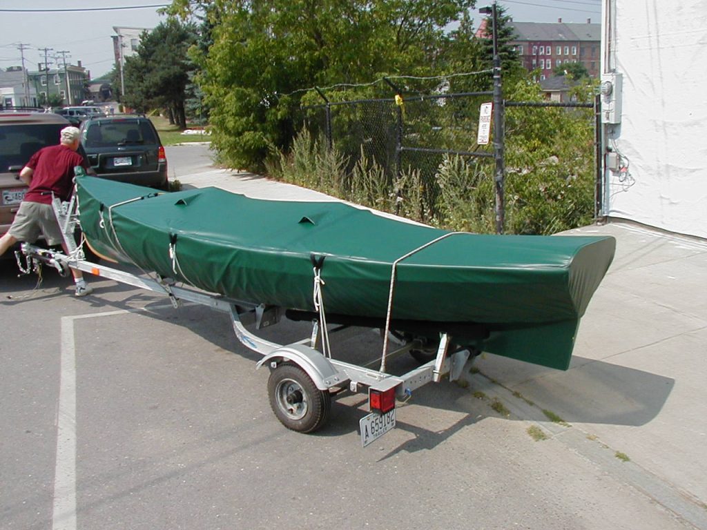 Green travel cover in place on trailer