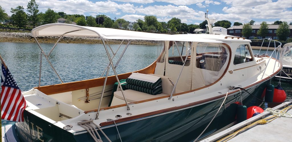 Full-length awning and winter back on picnic boat.